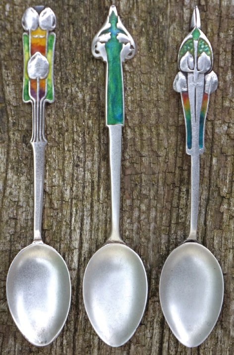 A trio of antique arts and crafts spoons