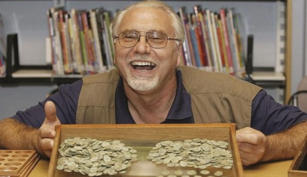 Dave Crisp with the haul of Roman coins from the Frome Hoard