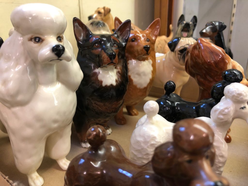 Various pottery dogs in Beswick Collection