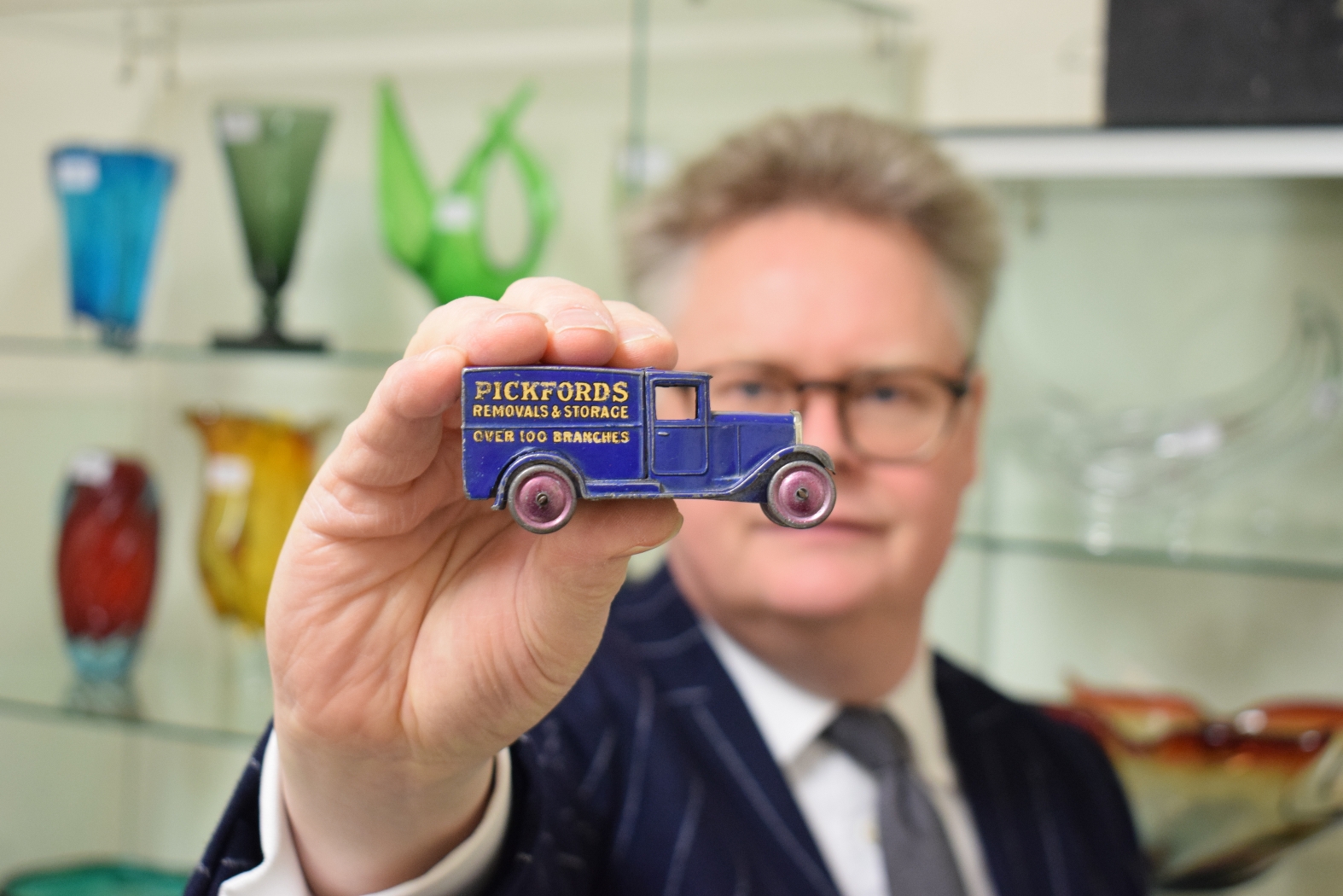 Auctioneer with Dinky Toys van