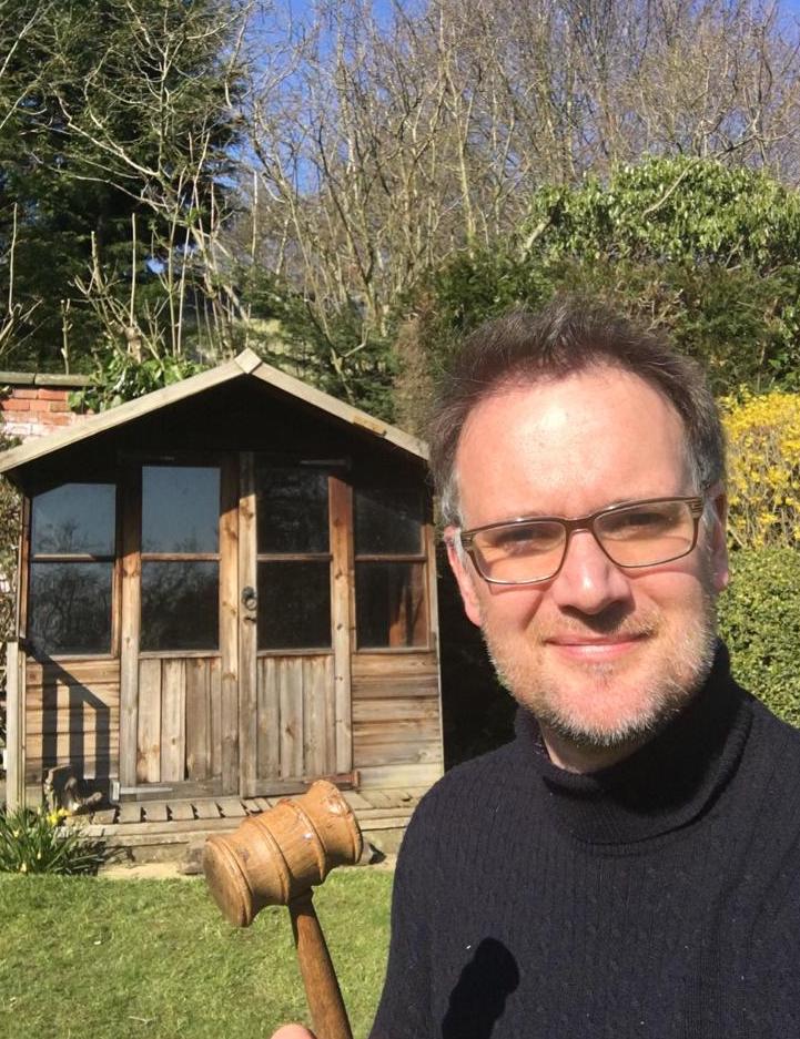 Charles Hanson gets set for his charity auction in his garden shed