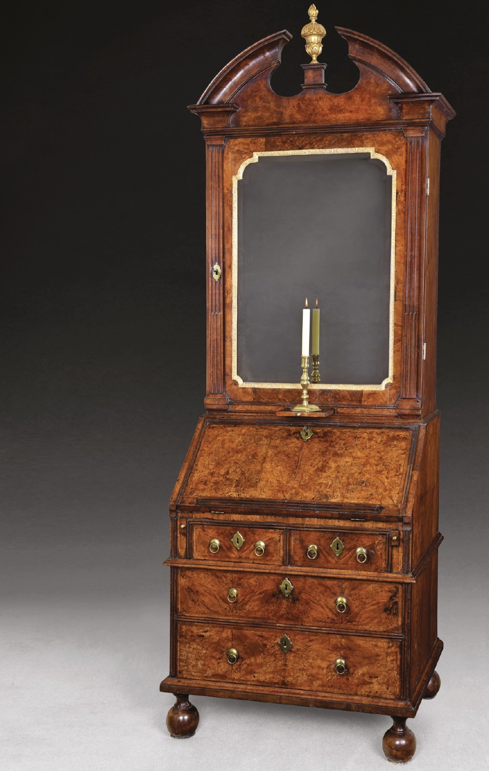 An antique burr walnut bookcase