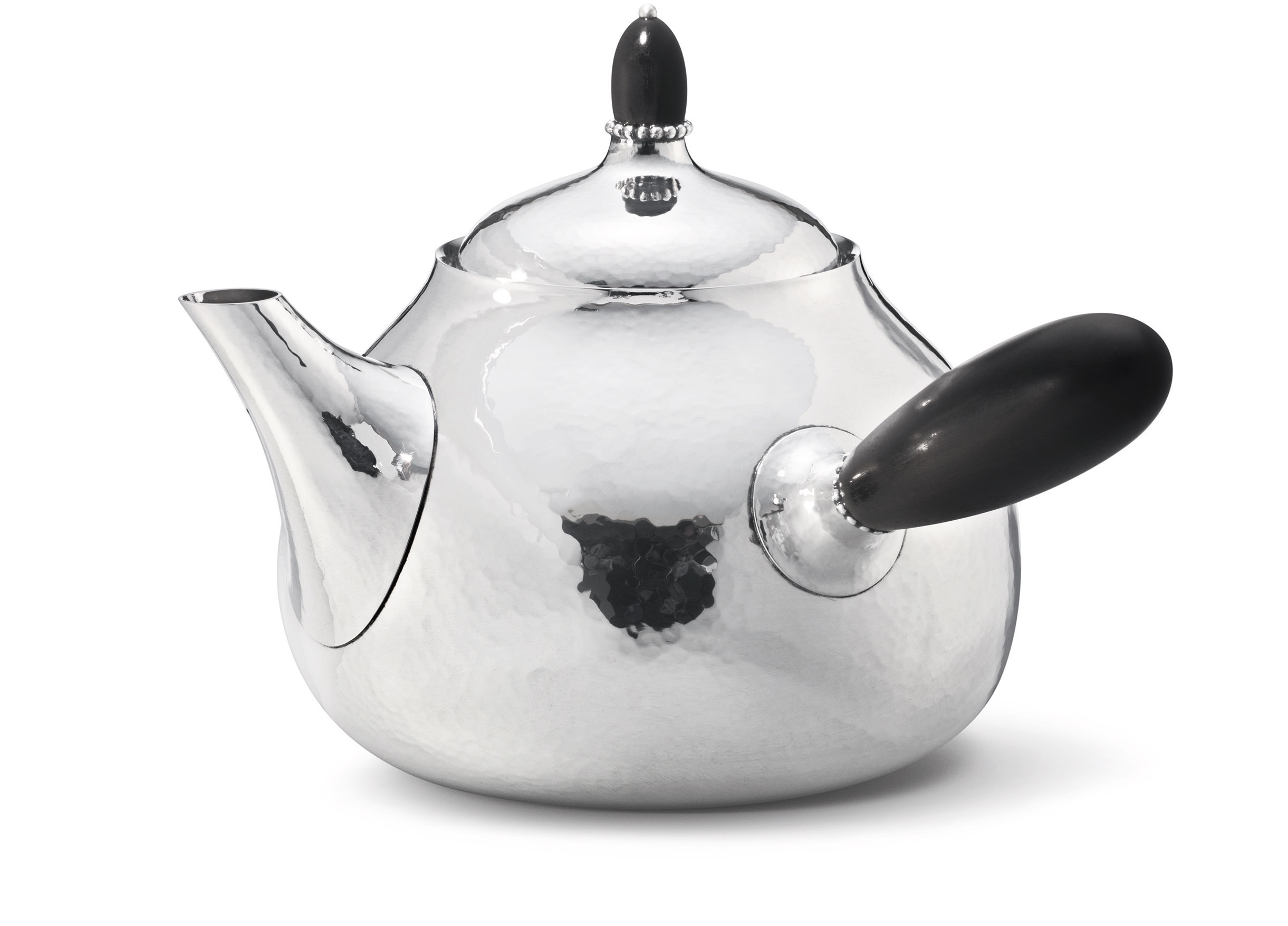 A classic art nouveau Georg Jensen tea pot with ebony handle