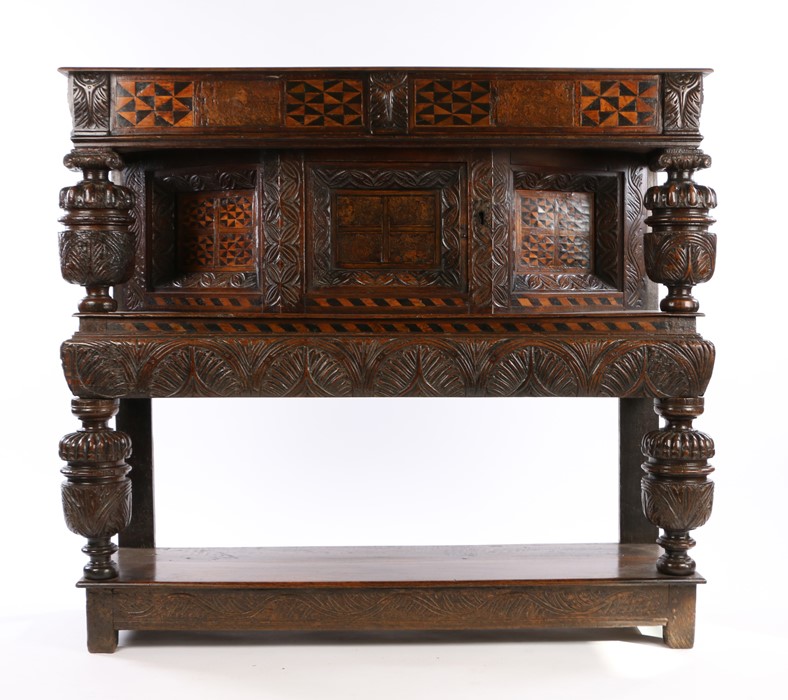 a Late Elizabethan/James I oak & inlaid canted cupboard, English, Sussex