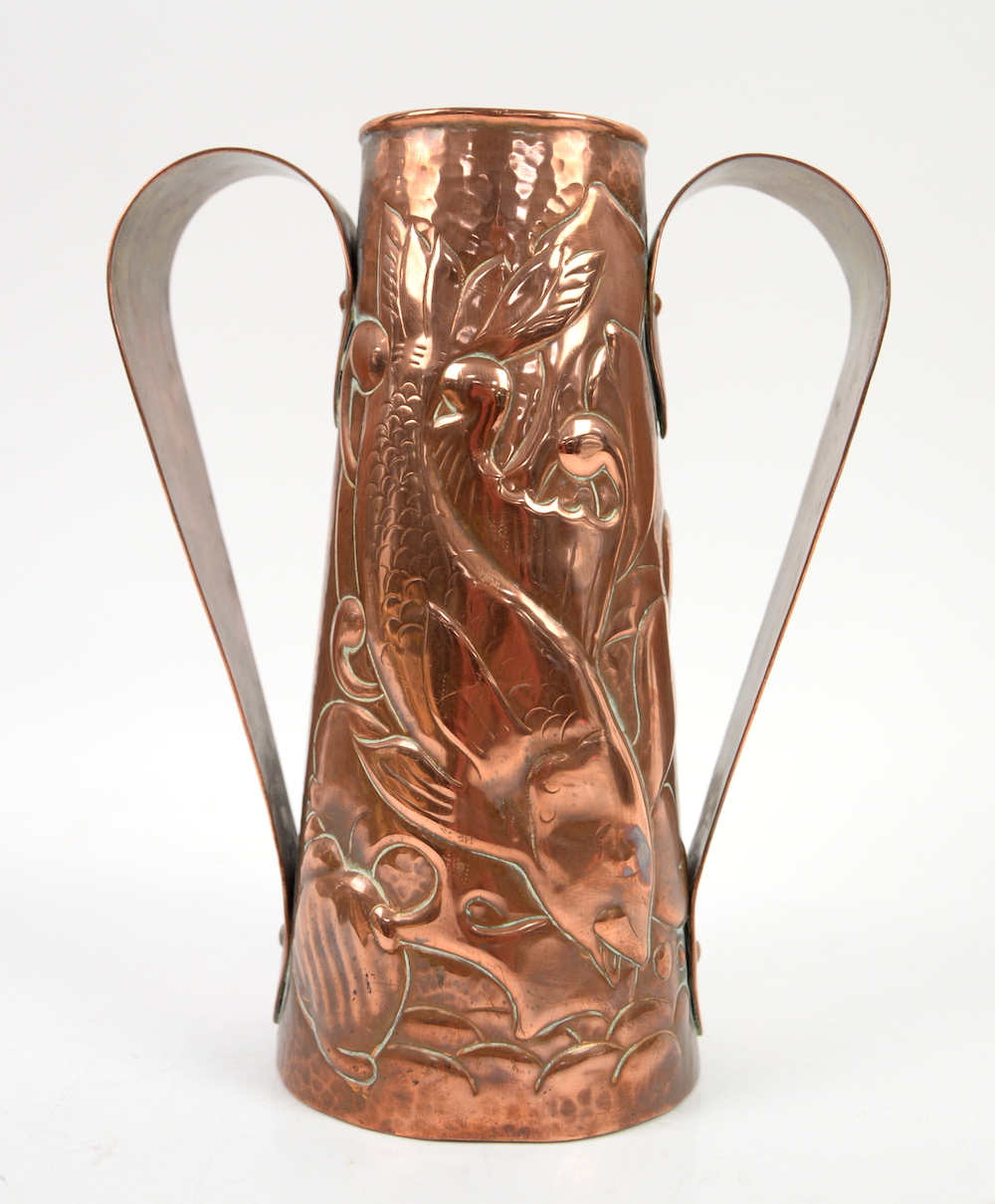 A copper twin-handled jug vase of tapering form made in Newlyn, Cornwall