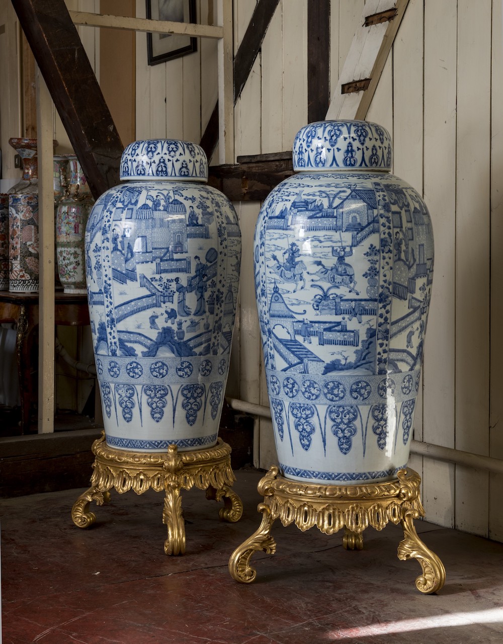 A pair of Chinese Kangxi blue and white 'soldier' vases and covers, on giltwood stands (estimate £100,000-150,000)