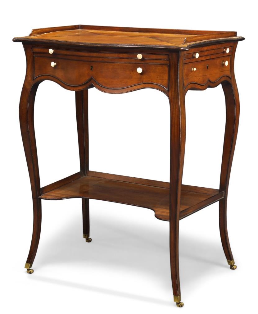 George III satinwood and crossbanded serpentine writing table, to a design by Thomas Chippendale