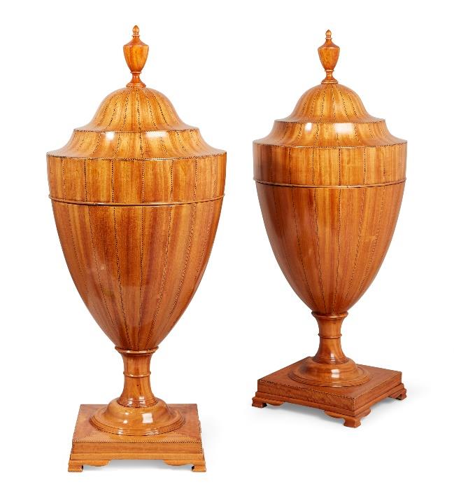 A pair of George III Sheraton satinwood cutlery urns