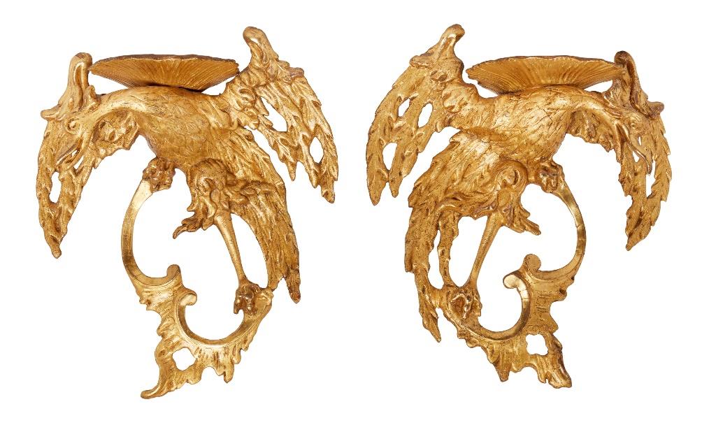 A pair of George II giltwood and gesso Ho-Ho bird wall brackets