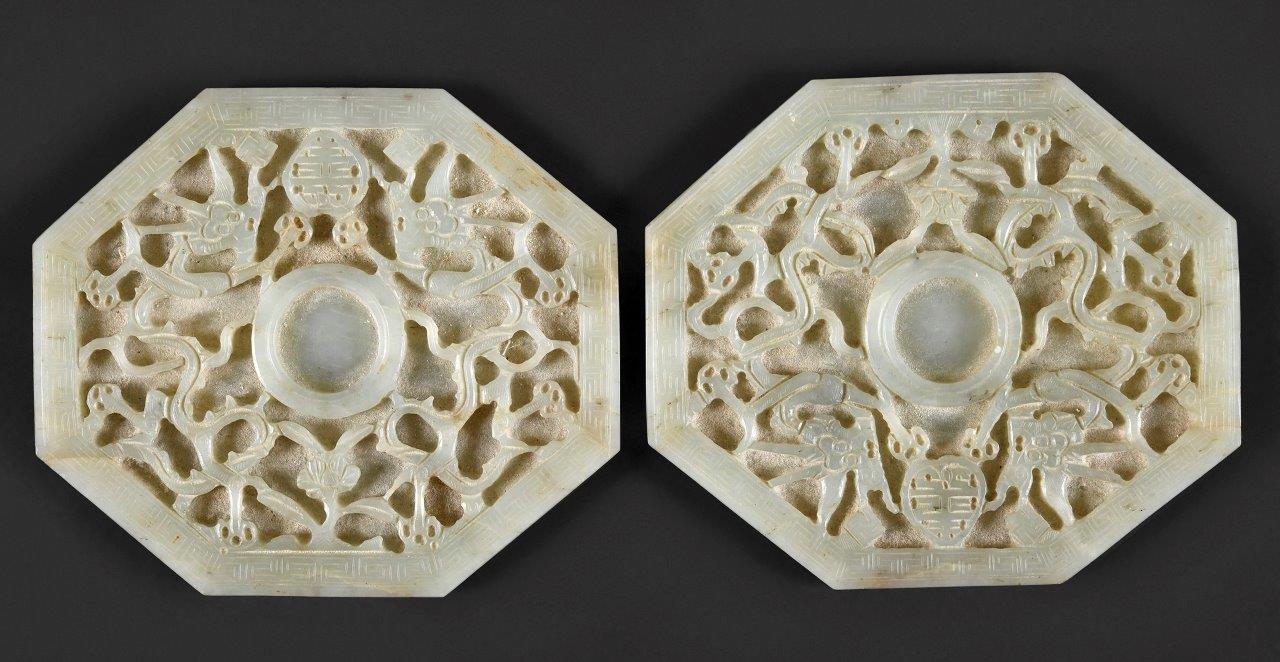 a pair of Chinese pale celadon jade octagonal cup stands