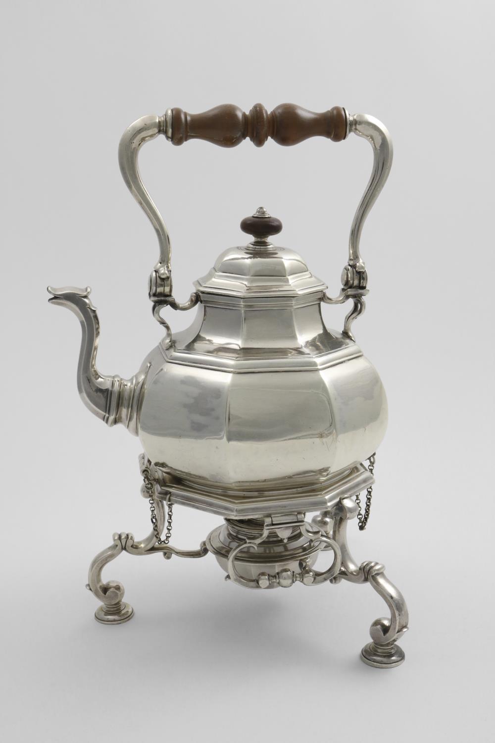 A George I swing-handled kettle with a burner