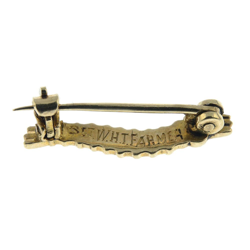 The reverse of a Caterpillar Club brooch that belonged to a WWII Spitfire pilot