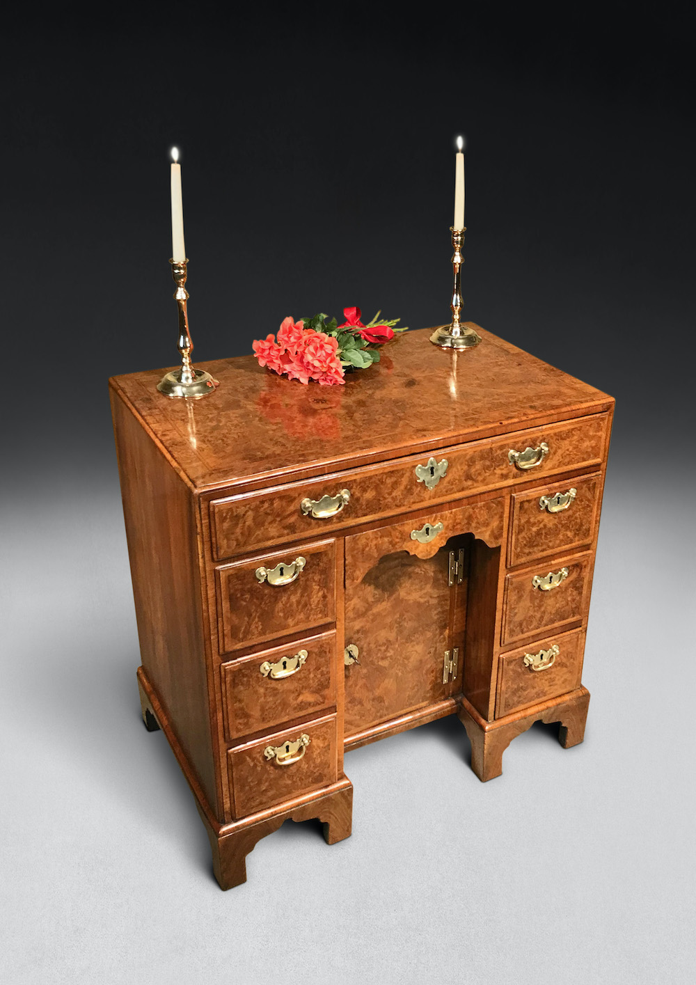 A George I period burr walnut kneehole desk