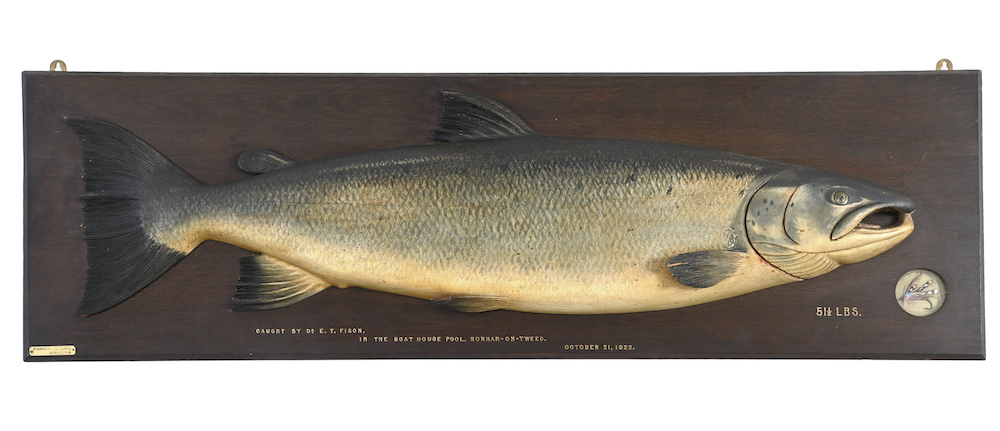 A carved wooden salmon