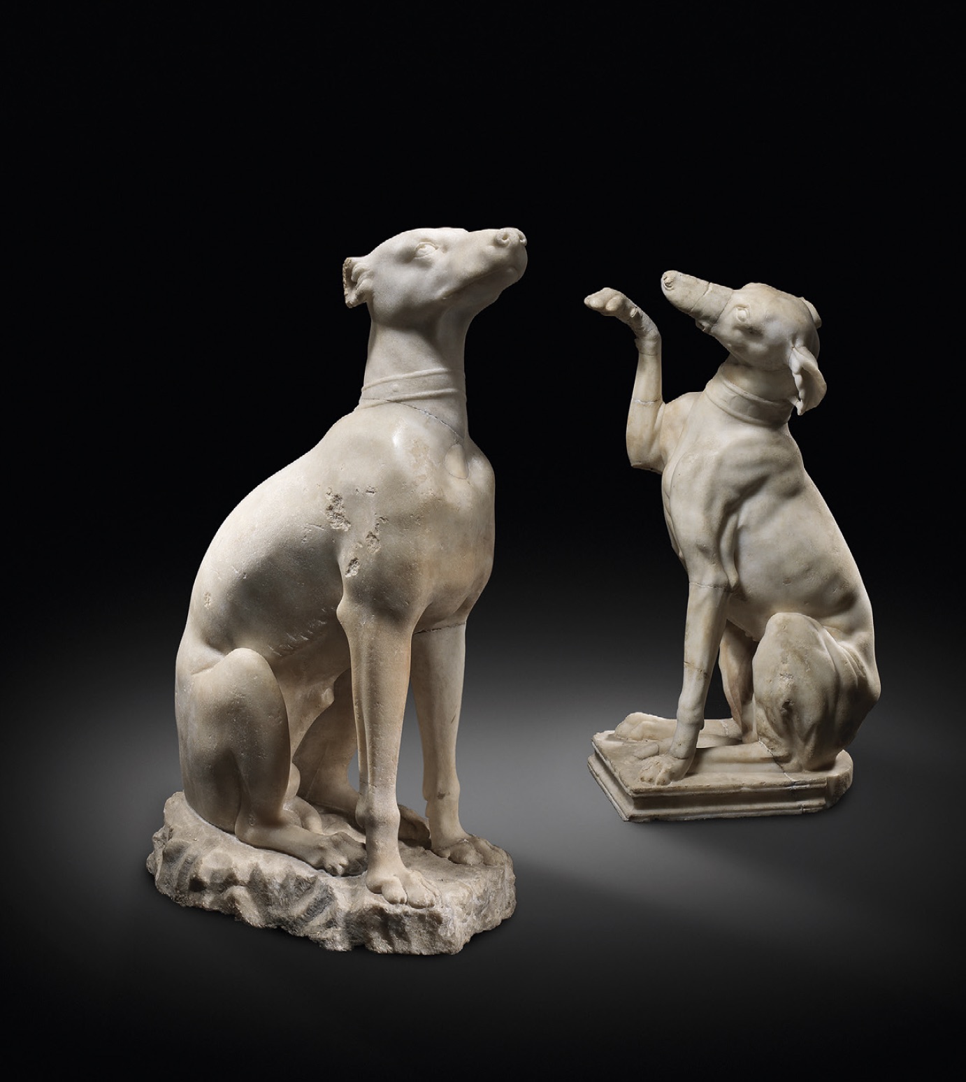 Two Roman marble figures of hounds