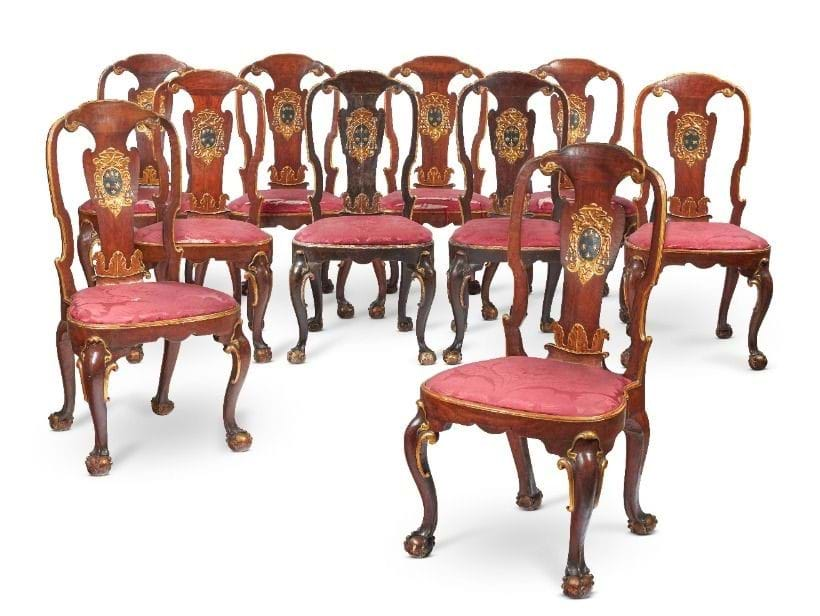 Eight George II walnut and parcel gilt dining chairs bearing the arms of the Altieri family