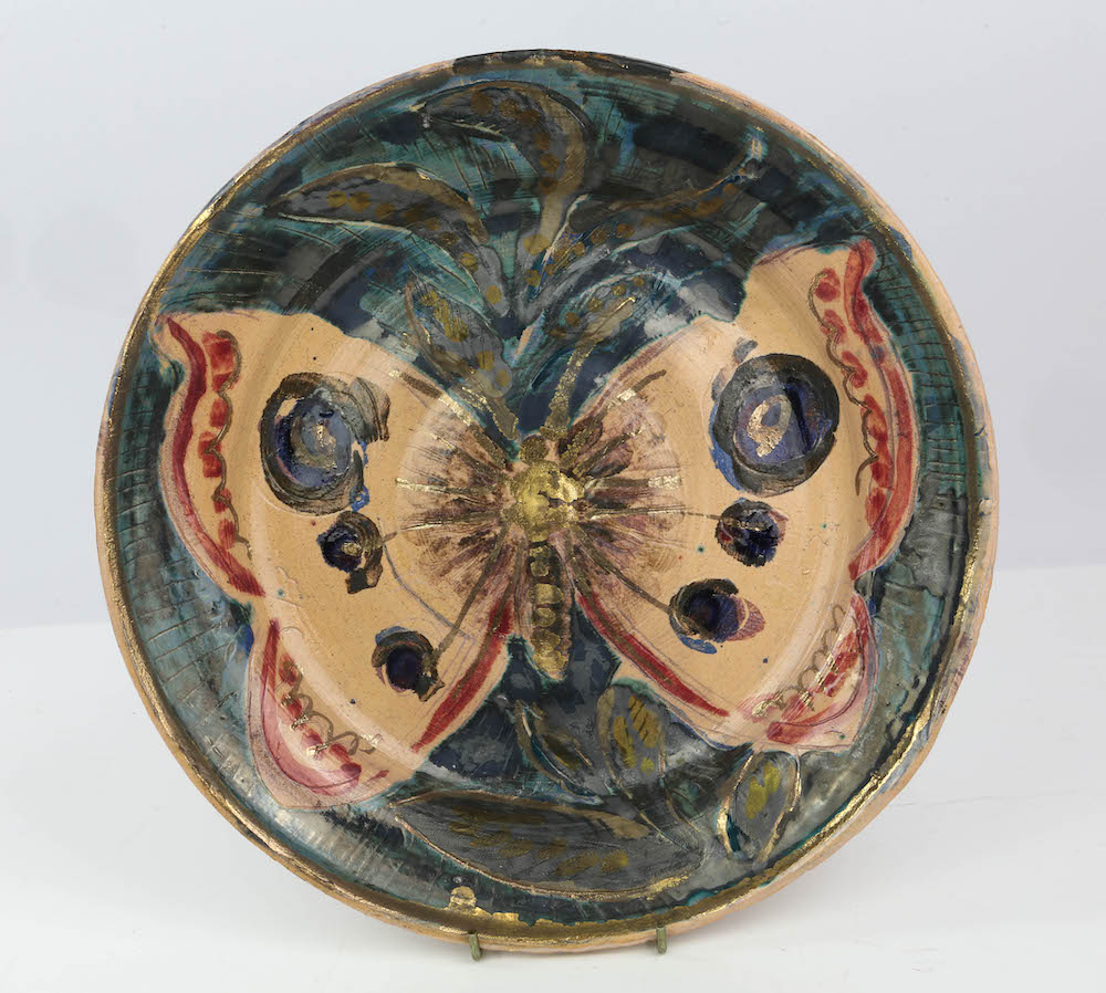 A 'Butterfly' ceramic charger by artist Quentin Bell