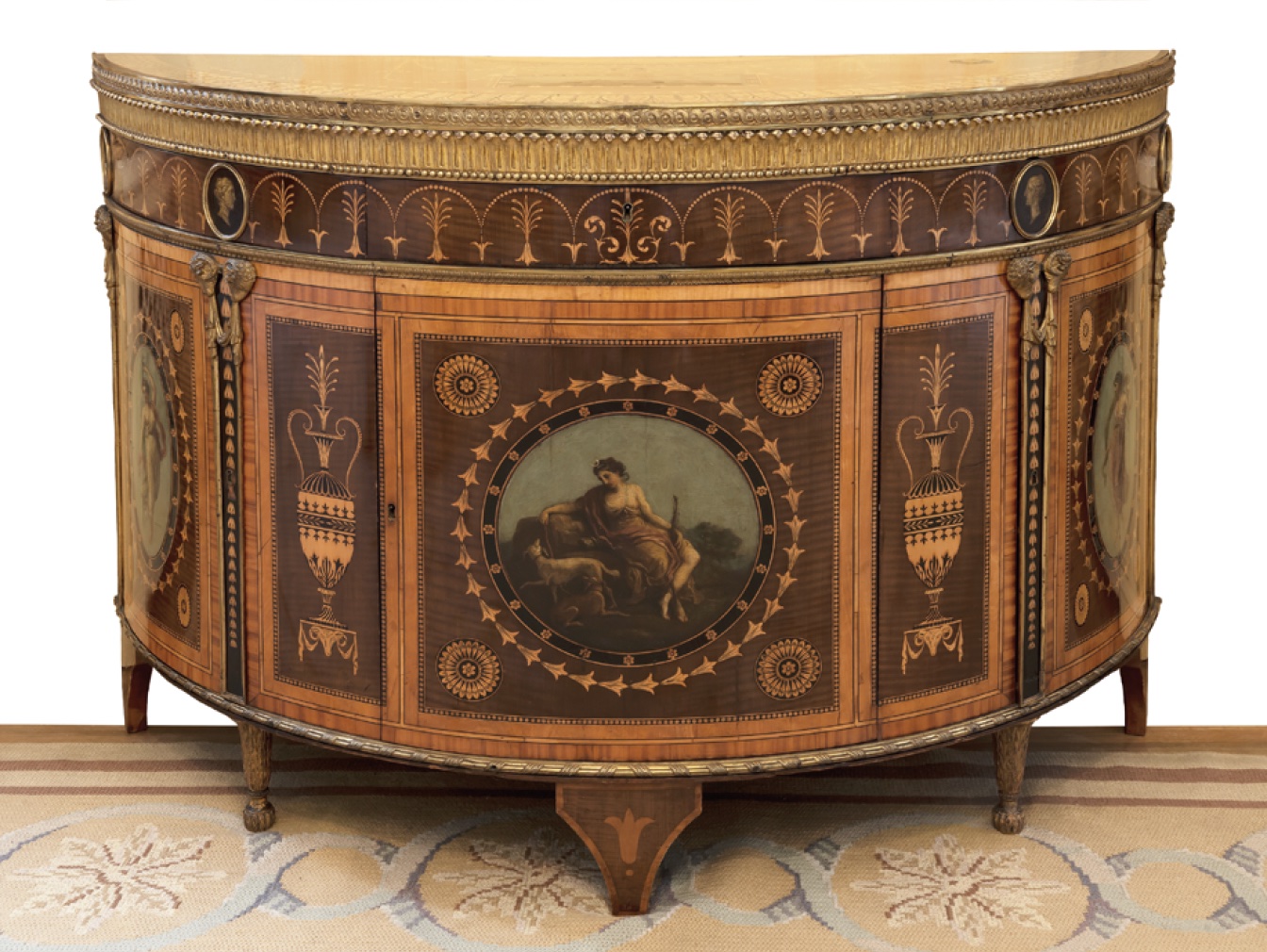 Commode with ‘Etruscan’ marquetry, painted decoration and ormolu mounts, made to the designs of Robert Adam for the Earl of Derby, 1775