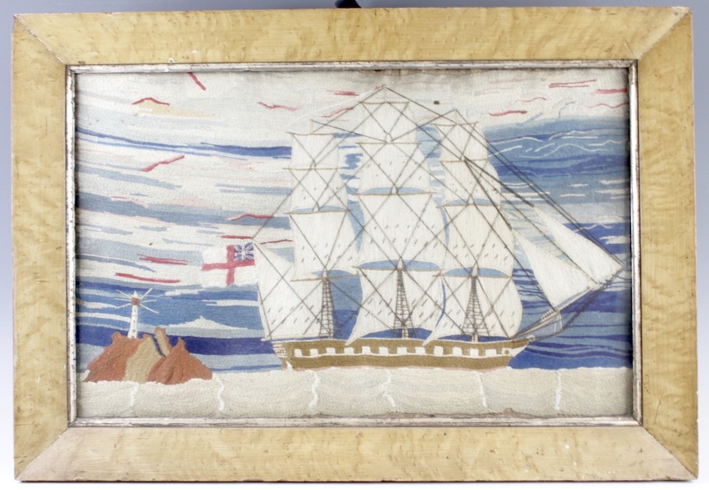 A Victorian sailor's woolwork depicting a three-masted naval ship in full sail and flying the British ensign