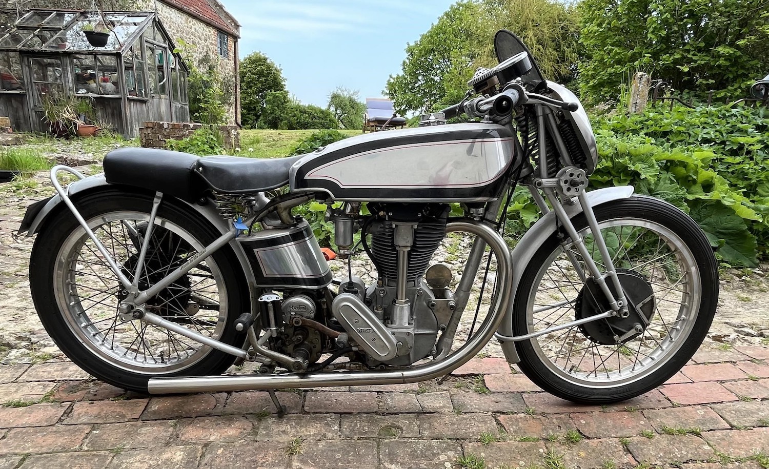 Dr Geo Cohen sat astride his 1927 Norton TT replica motorcycle at