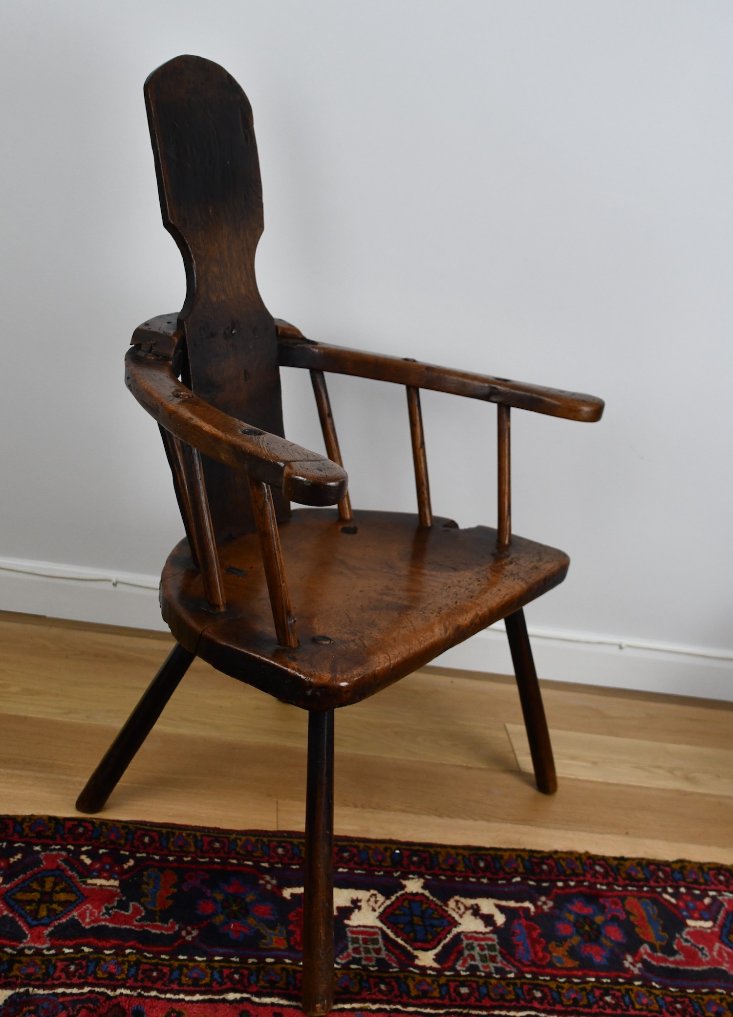 A rare late 18th century chair with a 'half-moon' sycamore seat