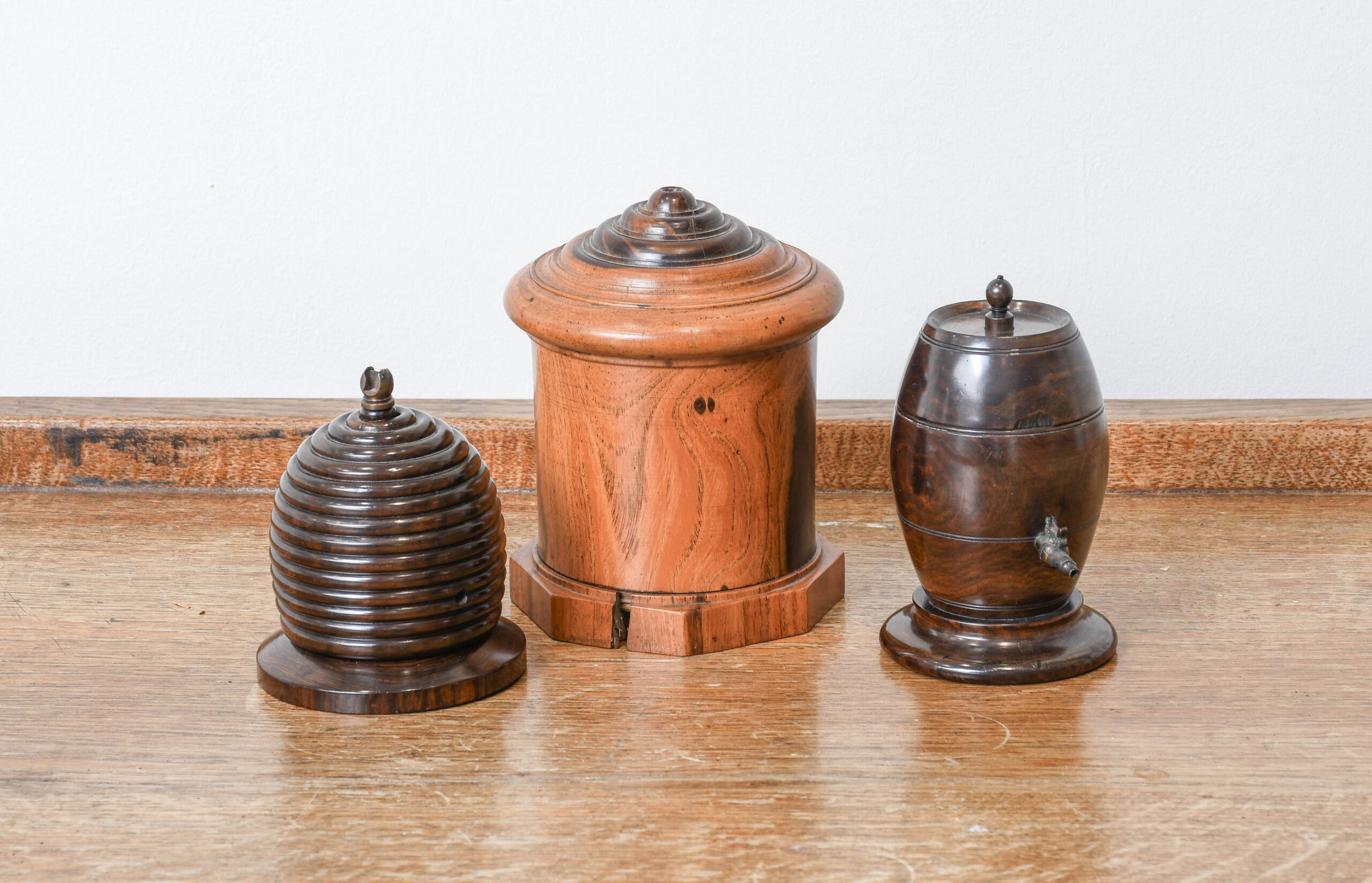 A group of antique treen string boxes