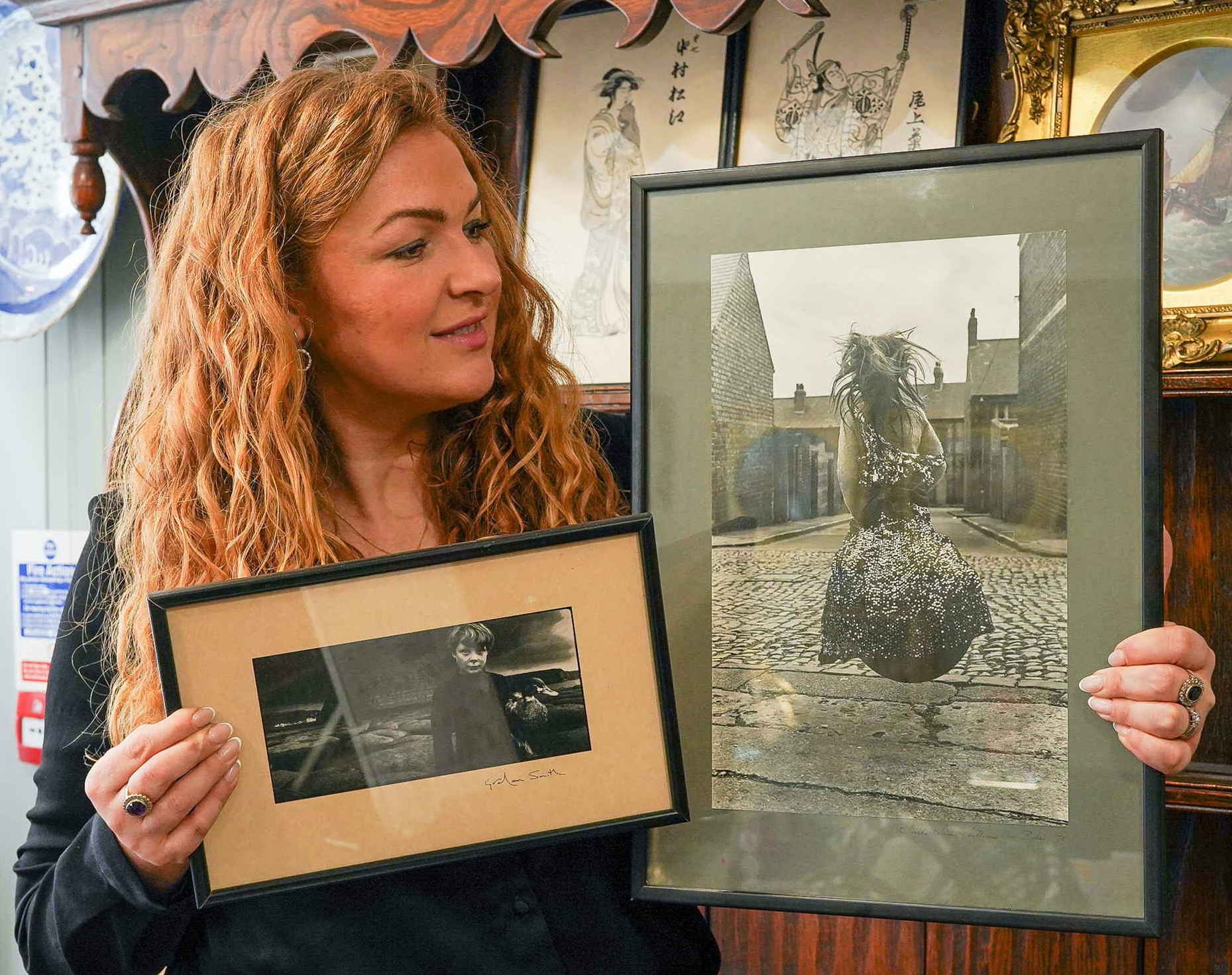 Antiques expert Irita Marriott with two photographs by Graham Smith and Sirkka Liisa Konttinen 