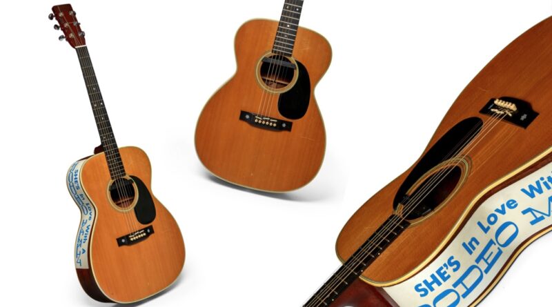 Different views of Eric Clapton's acoustic guitar in sale at Bonhams