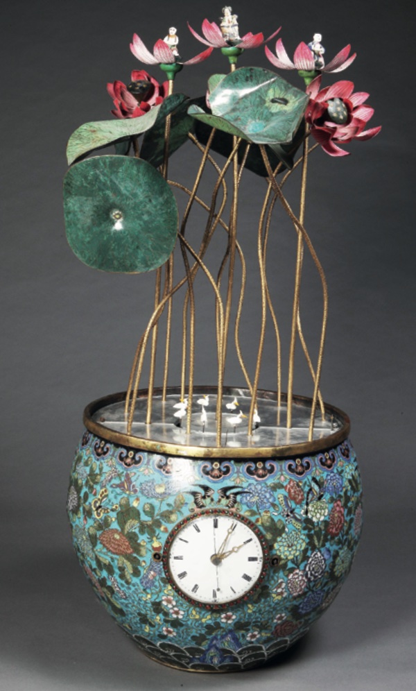 A Zimingzhong made up of a clock mechanism made in Guangzhou with the maker’s name Cheong Sing engraved in both Chinese and English. When wound, miniature birds swim on a pond to opening lotus flowers, early 1800s 