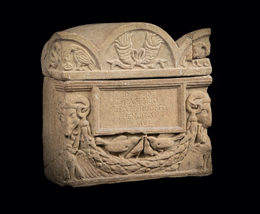 A Roman marble cinerary urn and lid