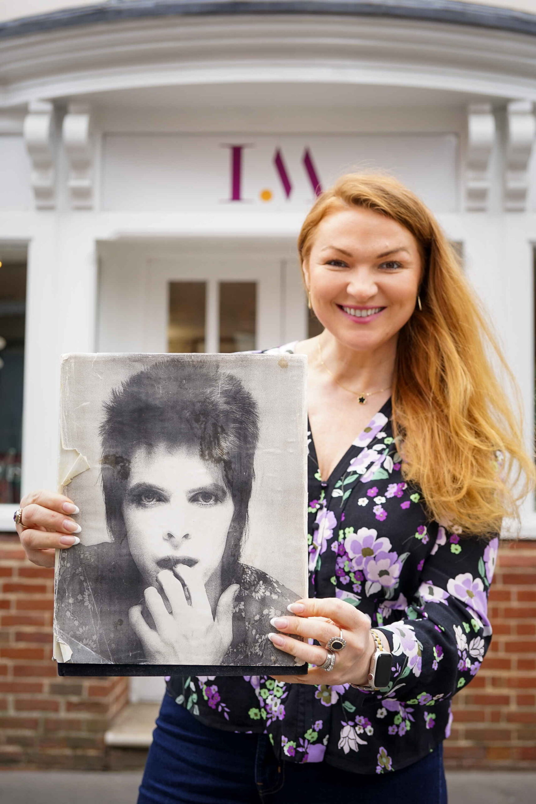 Irita Marriott, owner of Irita Marriott Auctioneers and Valuers, with the Bowie images sample book