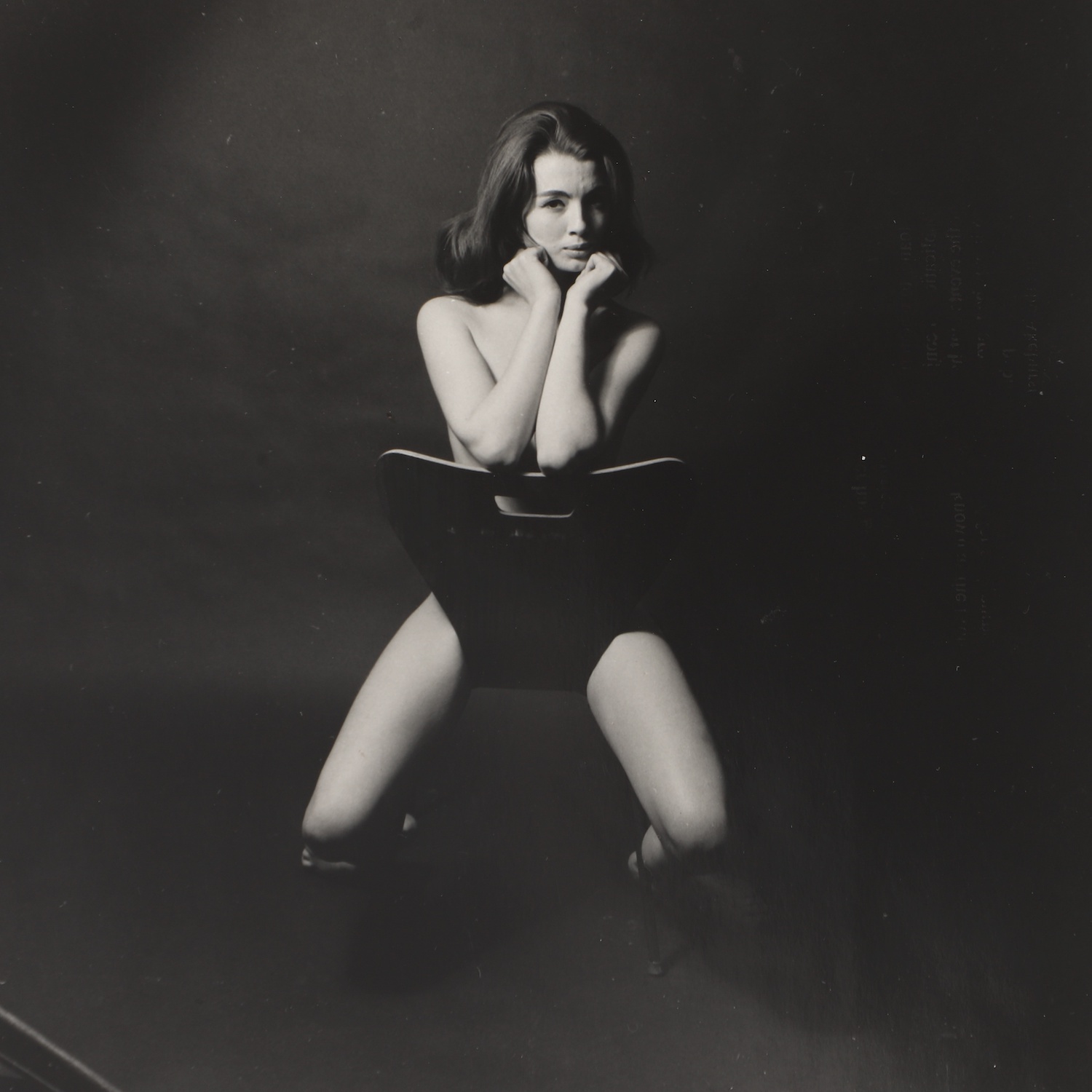 Lewis Morley photograph of Christine Keeler 1963, sitting astride Arne Jacobsen style chair 