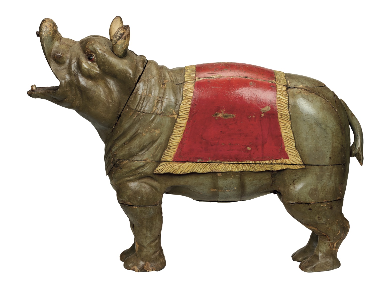 An antique carved hippopotamus from a fairground