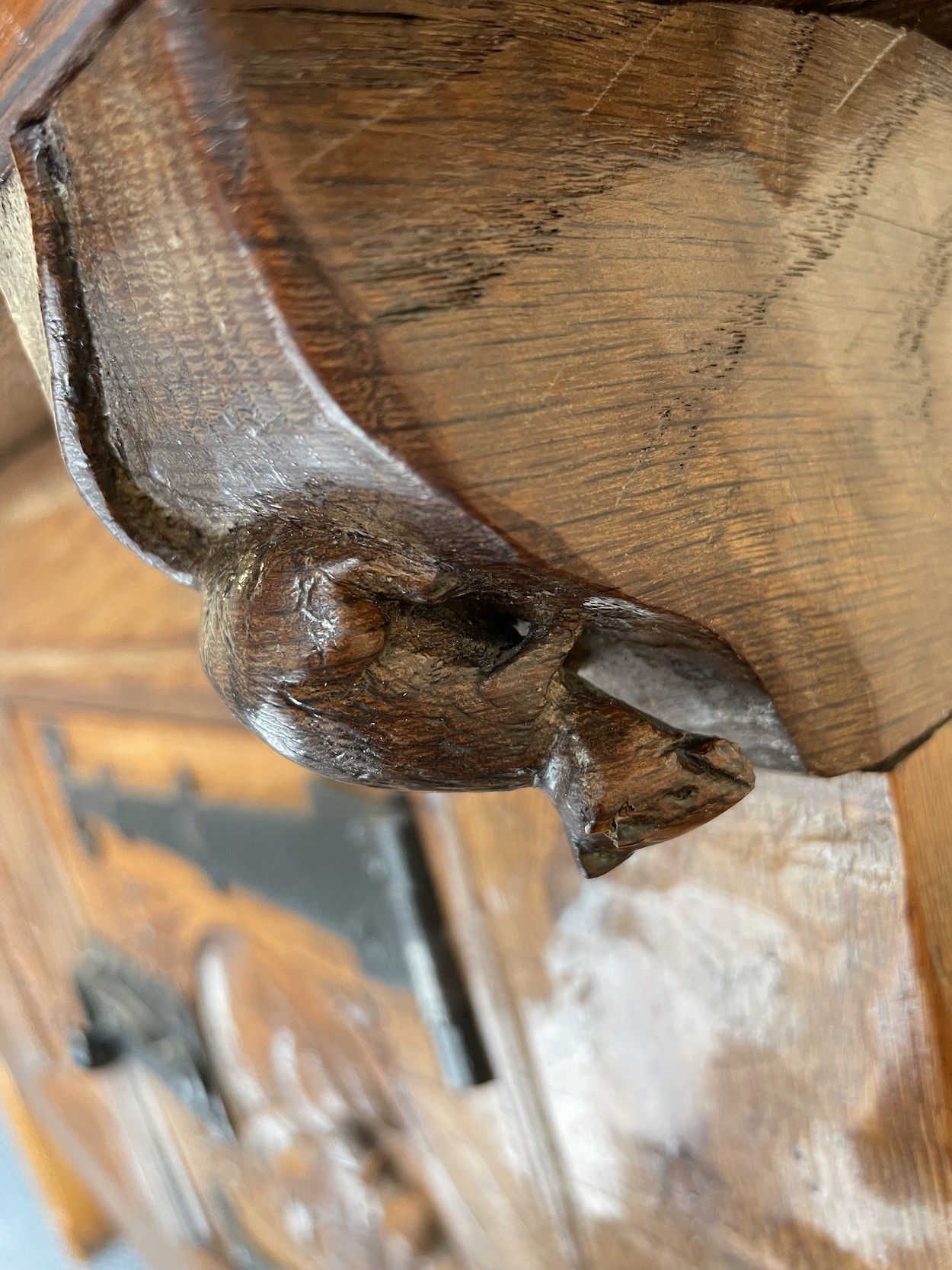 A carved mouse on a Robert 'Mouseman' Thompson English oak hutch cupboard 