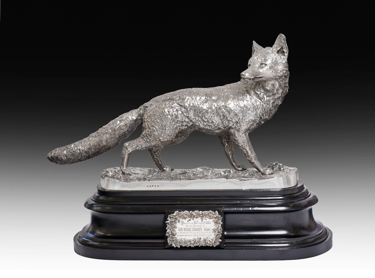 A life-size silver model of a wild fox