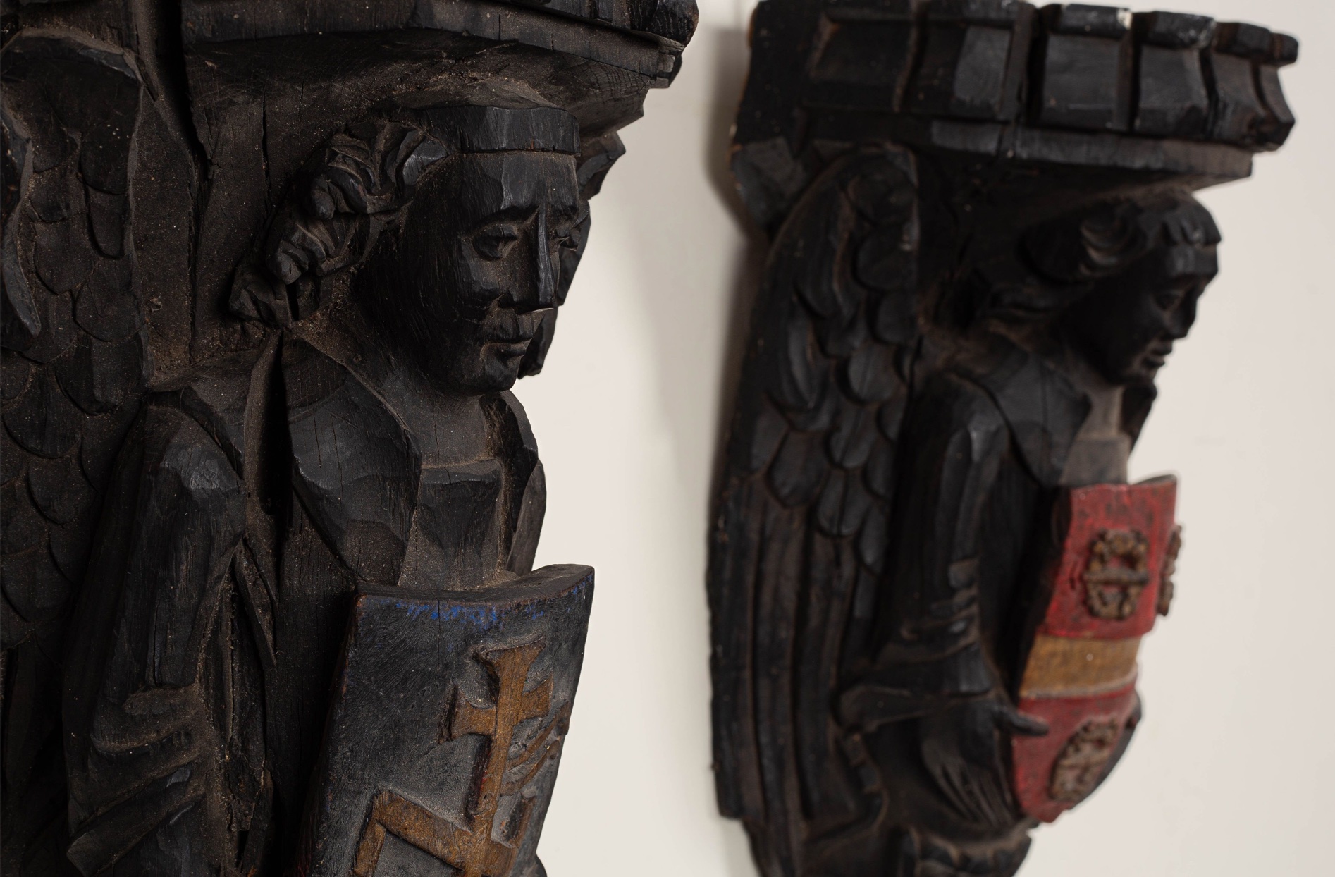 A pair of antique oak corbels