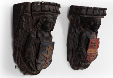 A pair of antique oak angel corbels