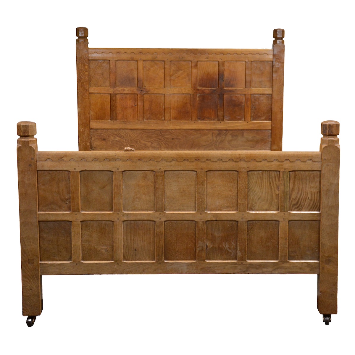 An antique bed from the workshop of Robert 'Mouseman' Thompson