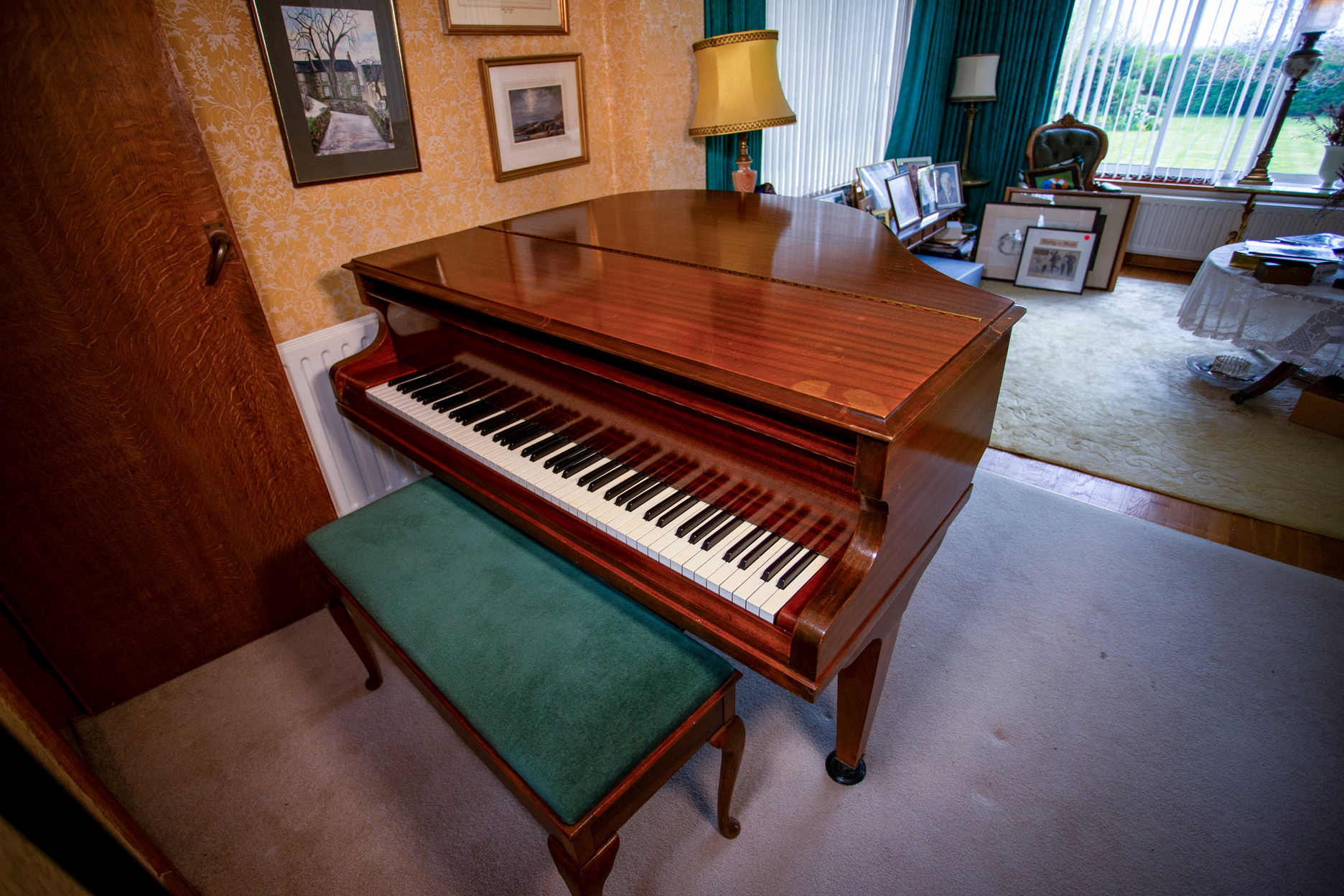 The Eric Morecambe Challen baby grand piano and matching stool