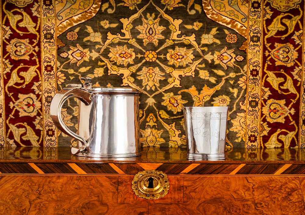 A pair of antique Newcastle silver tankards