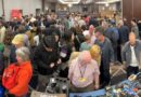 Visitors to the Photographica fair looking at vintage cameras