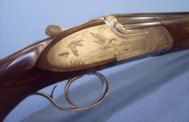Etched ducked hunting scene on antique sporting gun