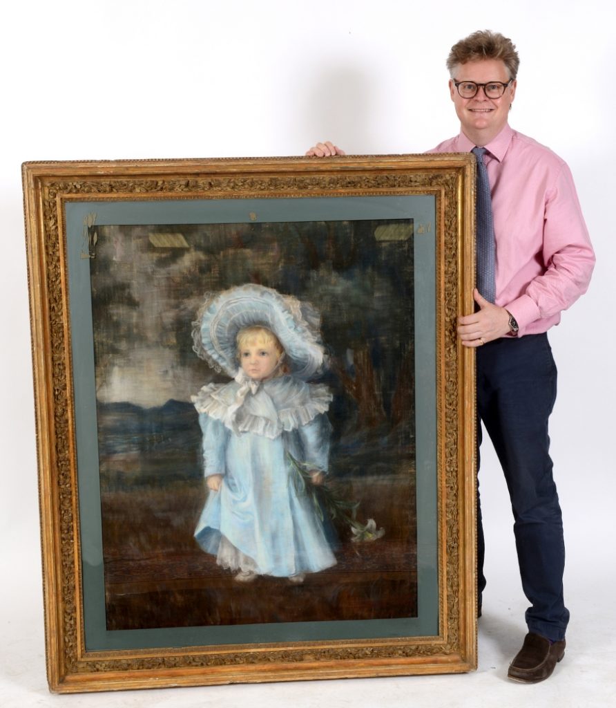 Martin Miller Antiques auctioneer Richard Bromell with pastel picture