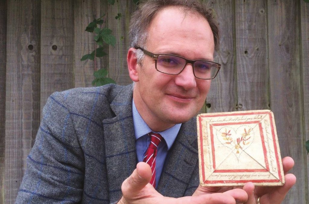 Auctioneer Charles Hanson with the antique love letter