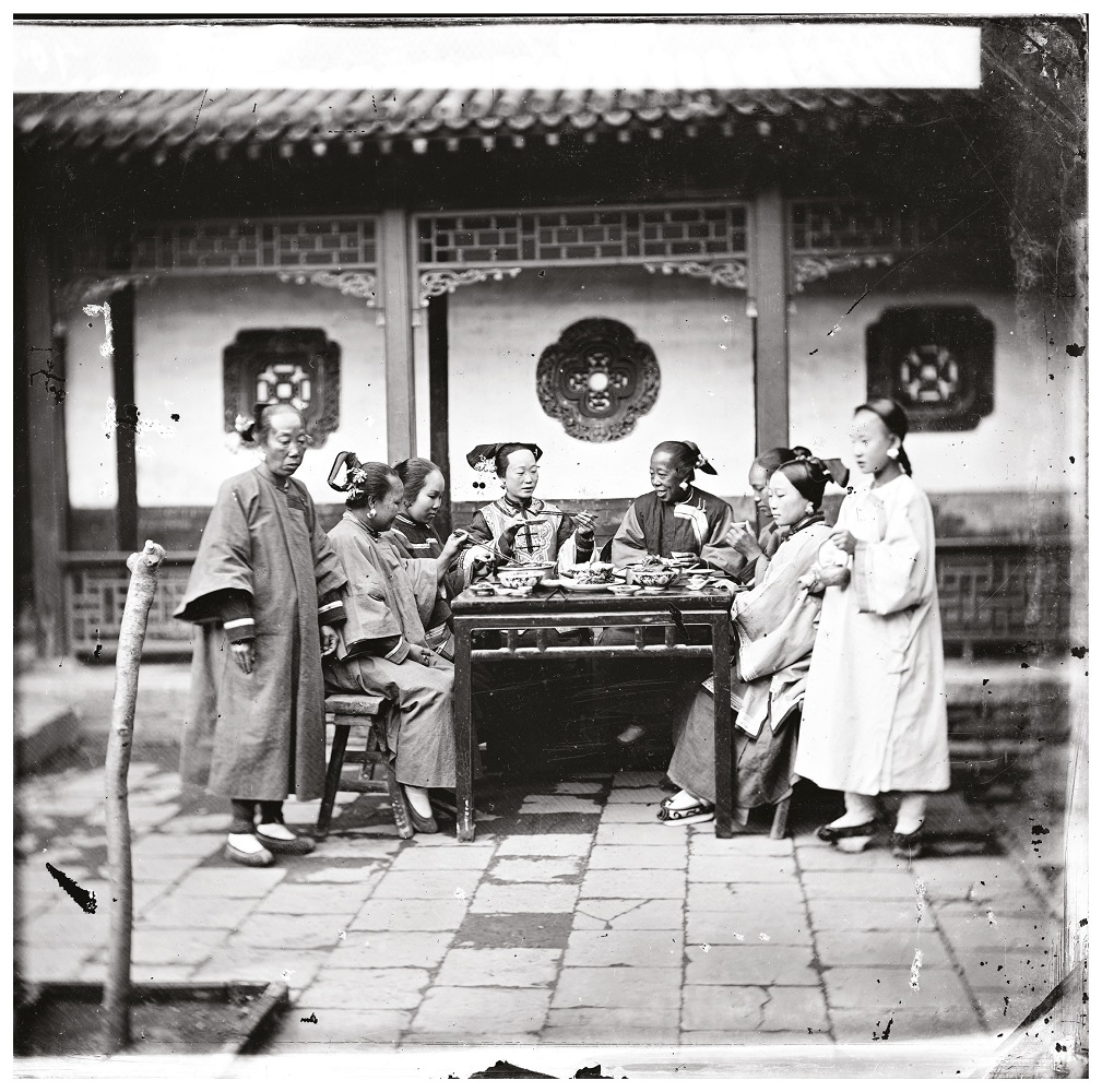 Scottish photographer John Thomson's image of Manchu ladies at a meal table