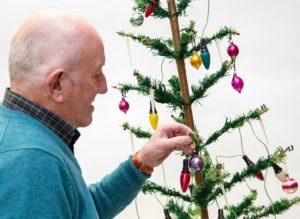 Steve Rose with his vintage Christmas tree - credit Hansons