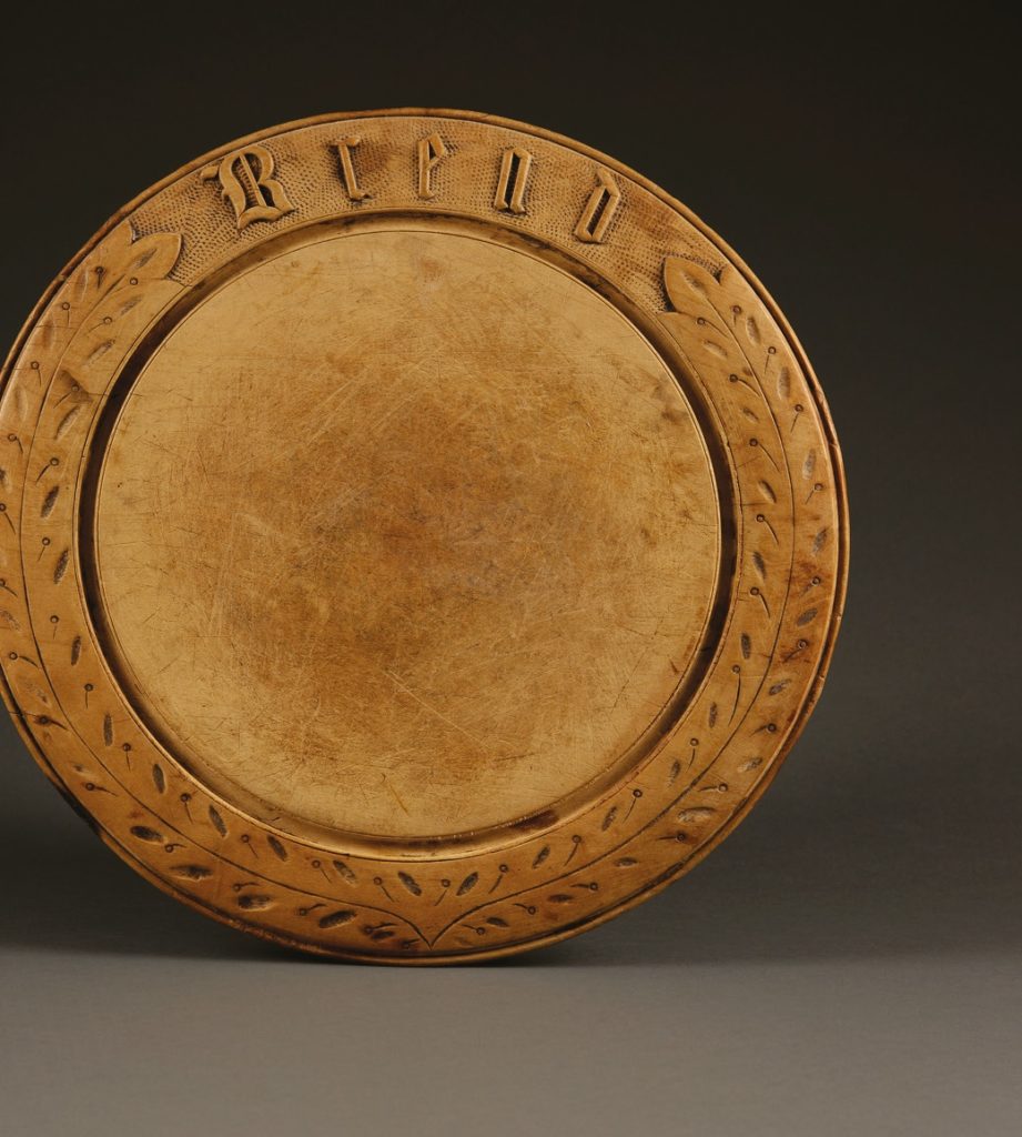 An antique breadboard with gothic font