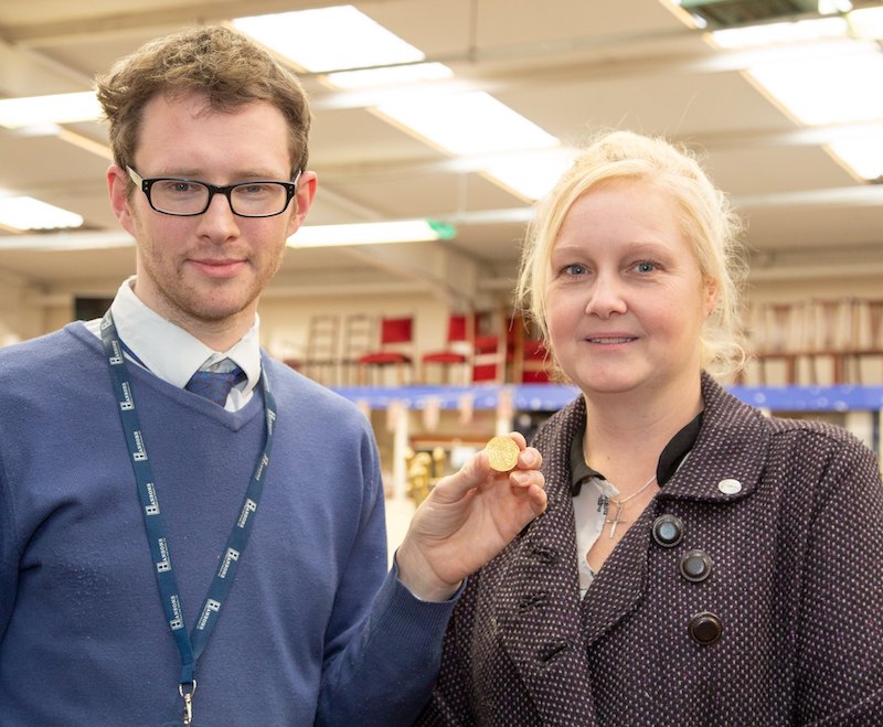 A gold coin found in an antique bureau