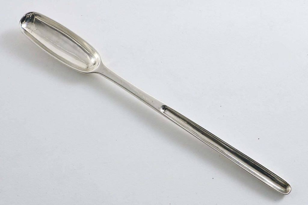 An antique silver marrow scoop