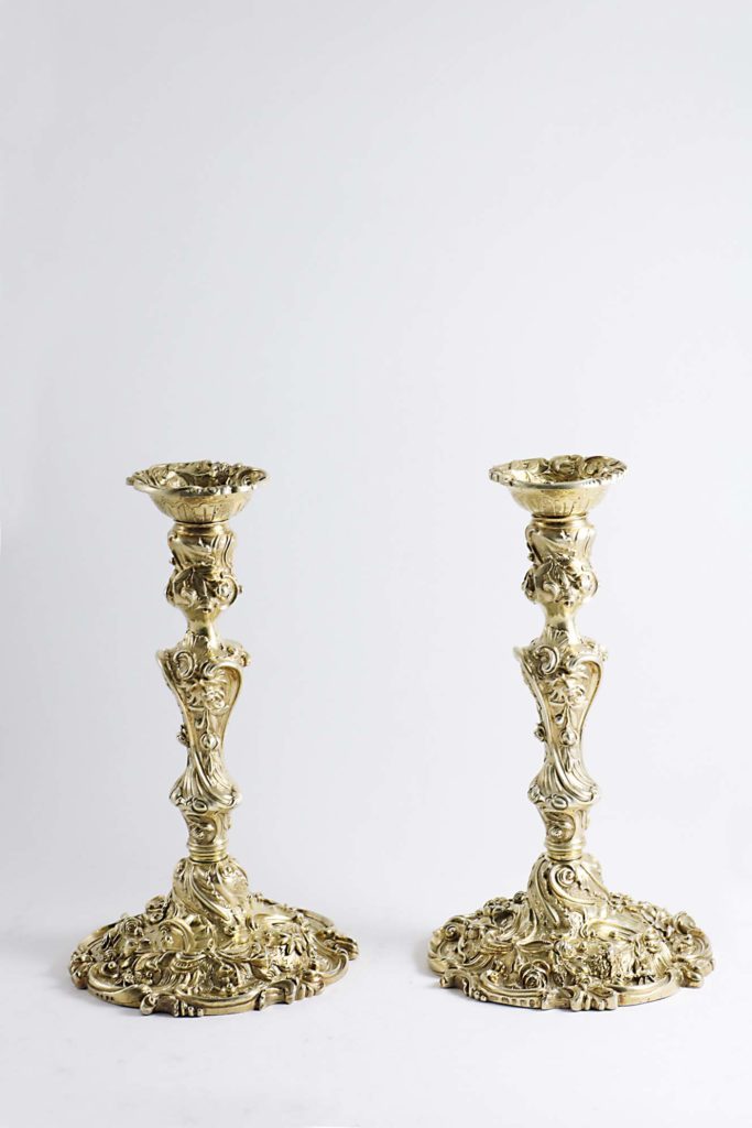 A pair of George III silver candlesticks